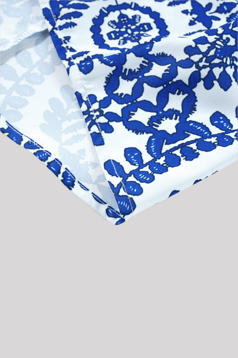 Sleeveless blue and white blouse
