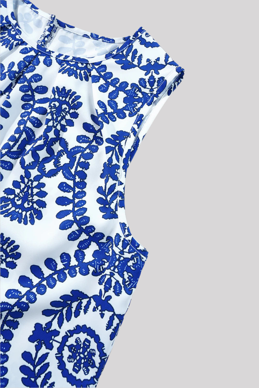 Sleeveless blue and white blouse