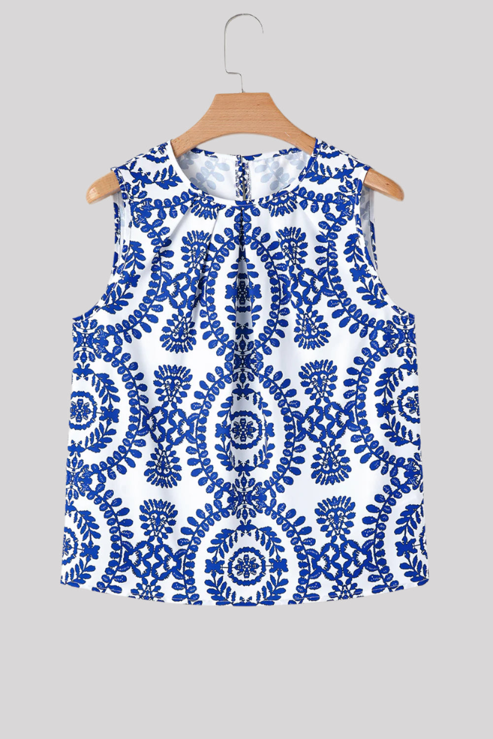 Sleeveless blue and white blouse