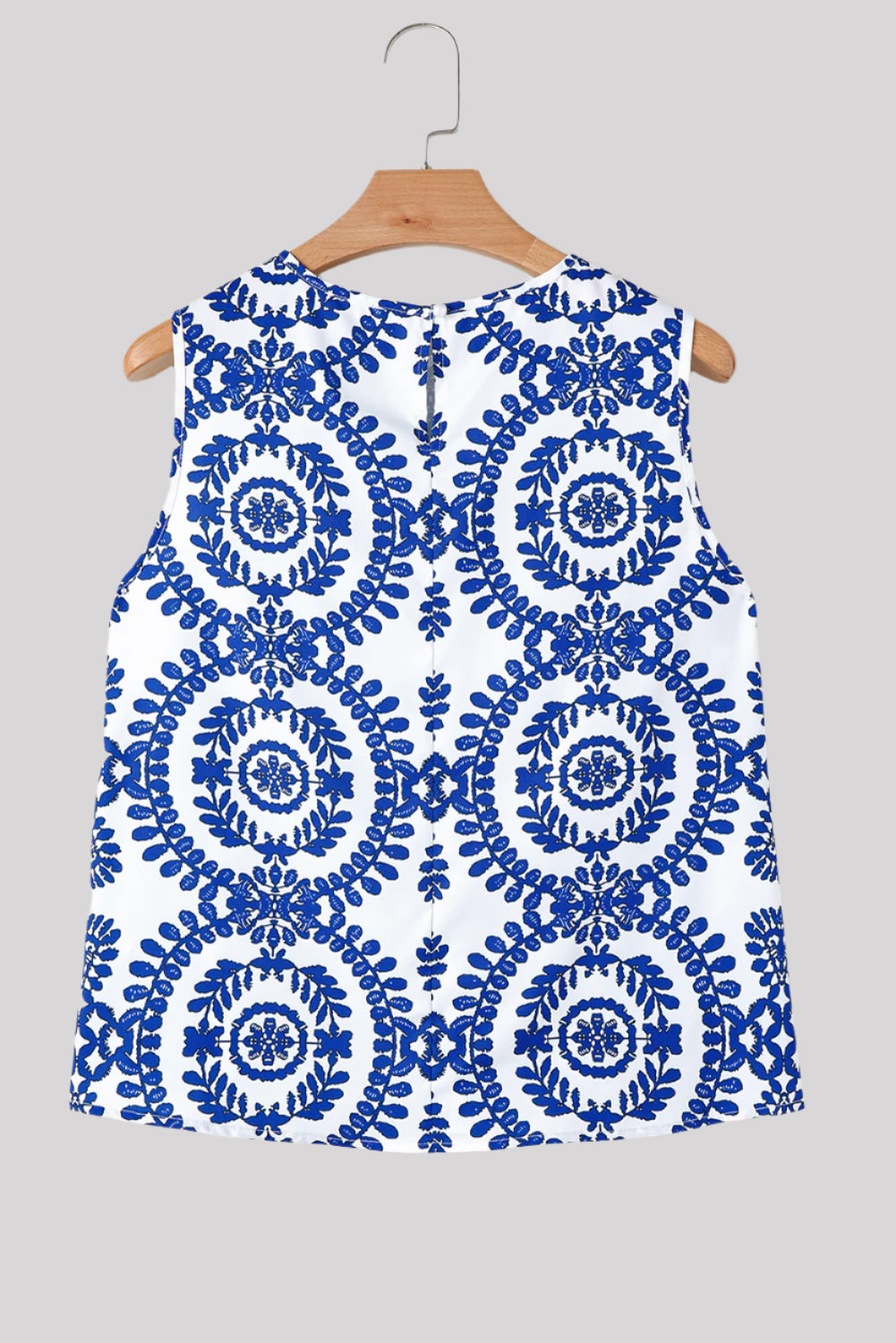 Sleeveless blue and white blouse